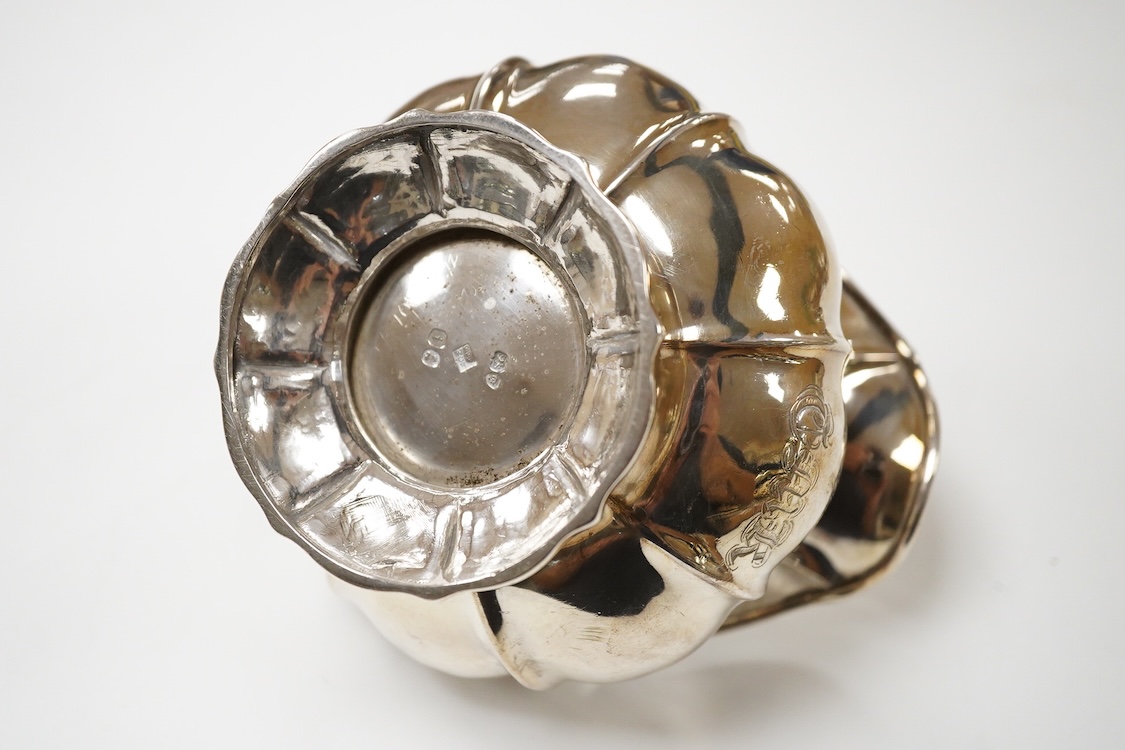 A George IV silver cream jug, with engraved monogram, by William, Charles and Henry Eley, London, 1824, height 10.5cm, 7.7oz.